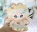 10cm cotton doll wearing a yellow cap and green dress